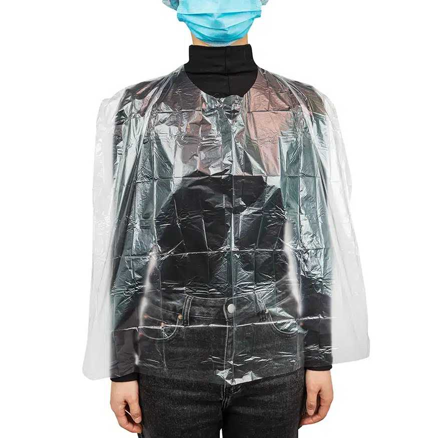 Tablier de coiffeur en plastique jetable pour la coupe de cheveux