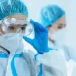 Doctors in protective clothing are making preparations