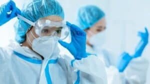 Doctors in protective clothing are making preparations
