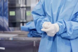 A doctor is wearing gloves
