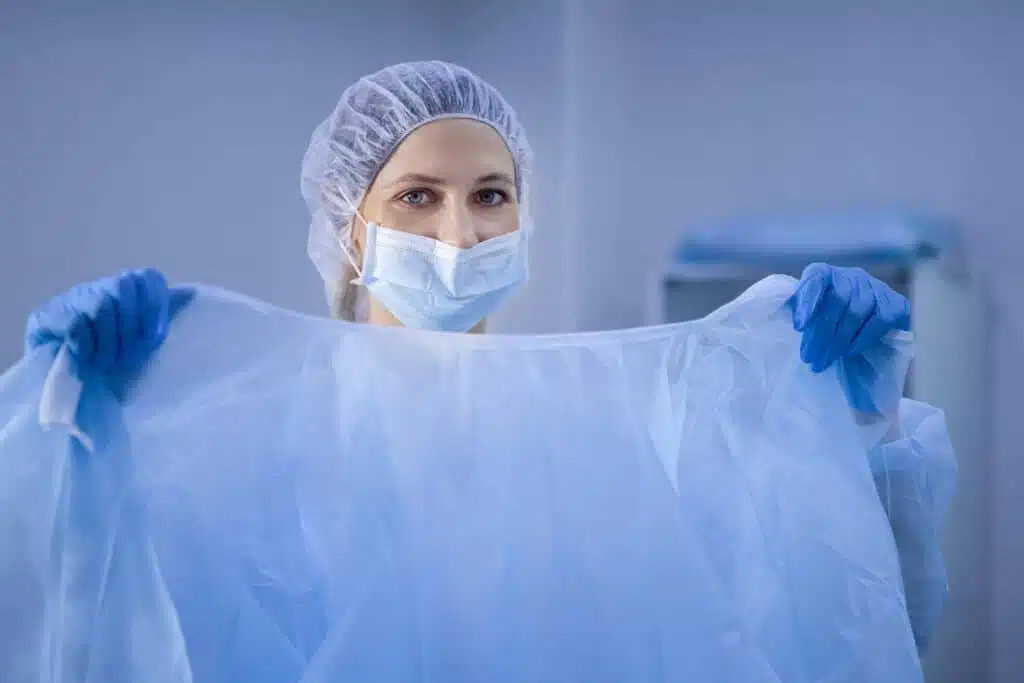 A woman holding the gown