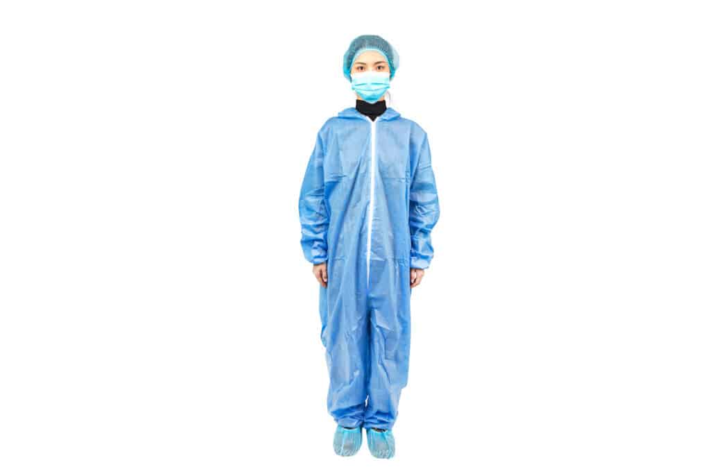 A woman in a hooded coverall without boots