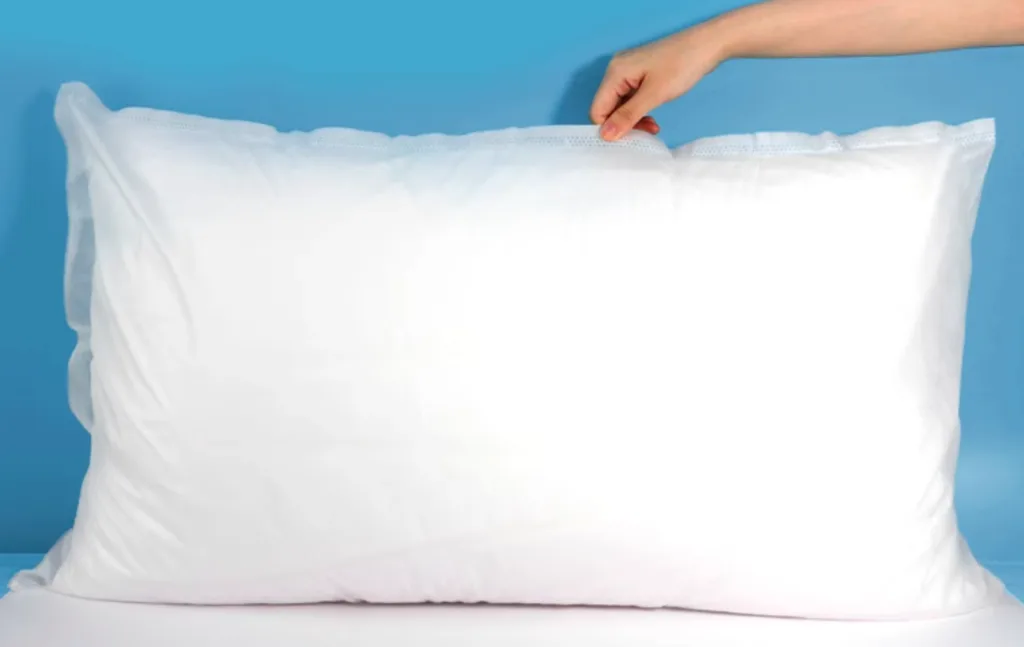 Hand zipping a pillow protector cover