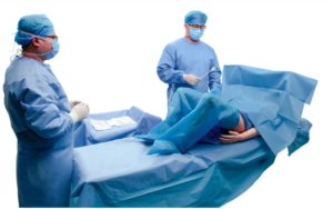 Surgeons performing medical procedure in operating room.