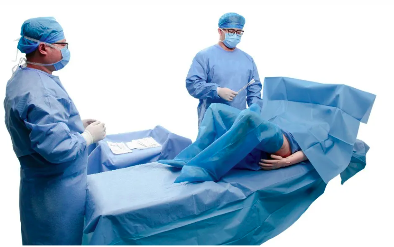 Surgeons performing medical procedure in operating room.