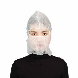 Person wearing a white hair net and mask