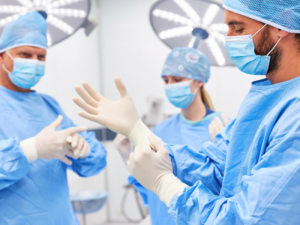 Surgeons in operating room preparing for surgery