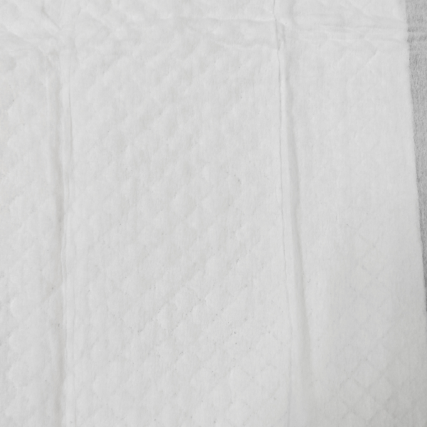 Close-up of white quilted fabric texture