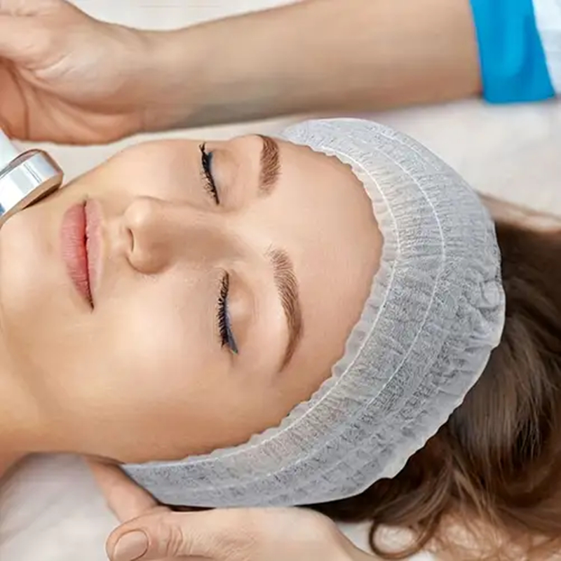 Woman getting a facial treatment at spa.