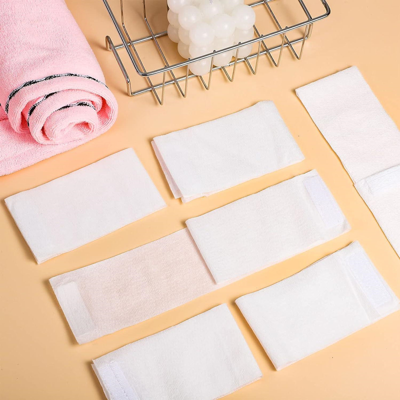 Folded towels and soap in wire basket.