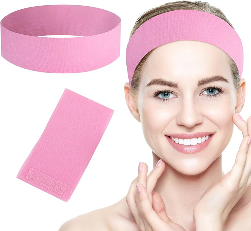 Woman wearing pink exercise headband and towel