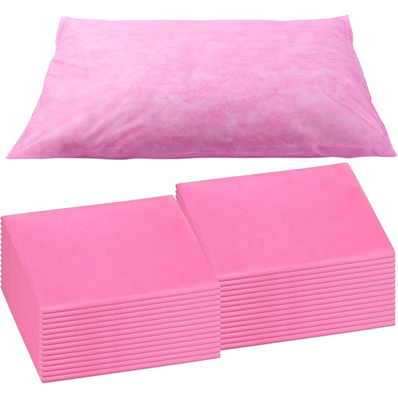 Pink disposable underpads and pillow protector.