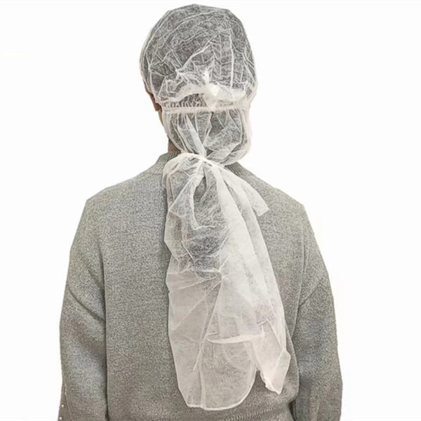 Person wearing disposable hair net.