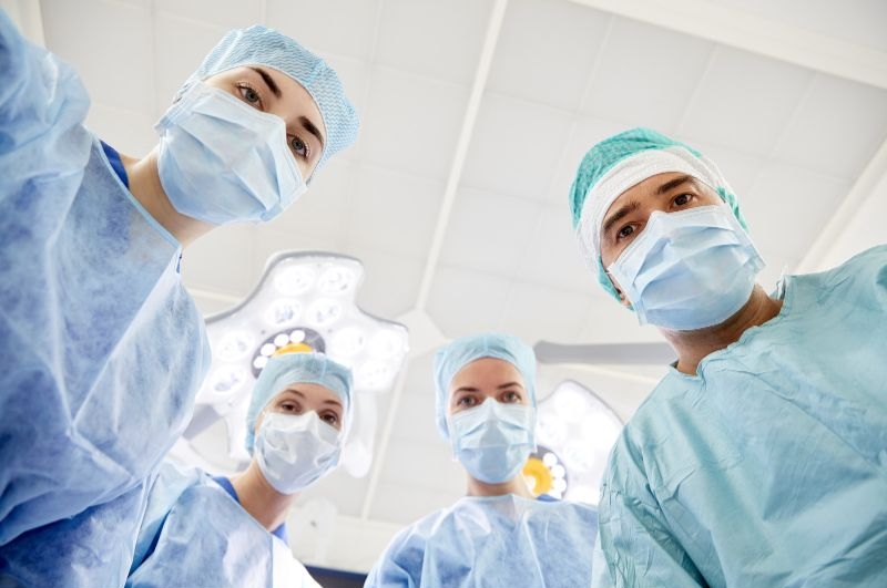 Surgeons performing surgery in operating room