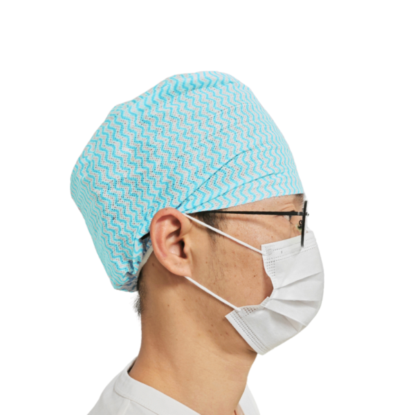 Doctor wearing medical cap and mask side view