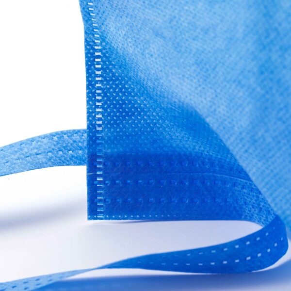 Close-up of blue fabric with stitching