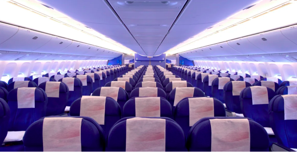 Empty airplane seats in cabin.