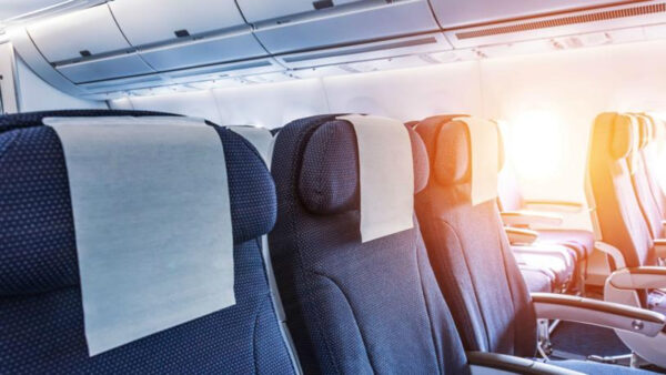 Empty airplane seats with sunlight.