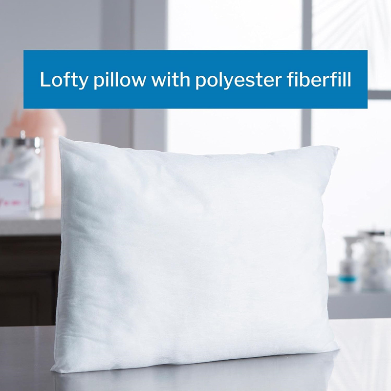 White polyester fiberfill pillow on table