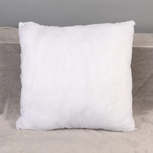 White square pillow on chair