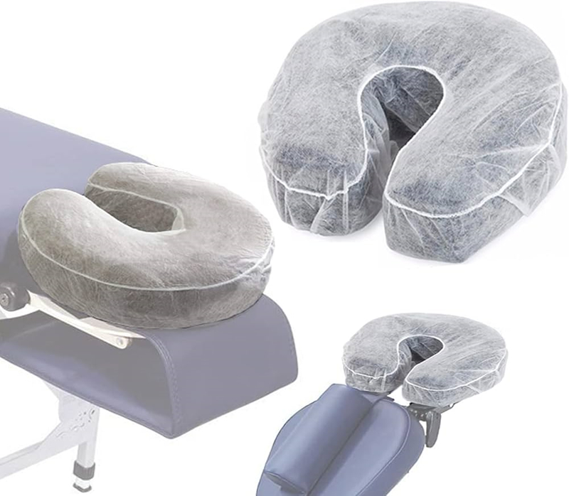 Massage table with disposable face cradle covers