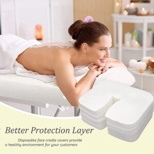 Woman on massage table with disposable face cradle cover.