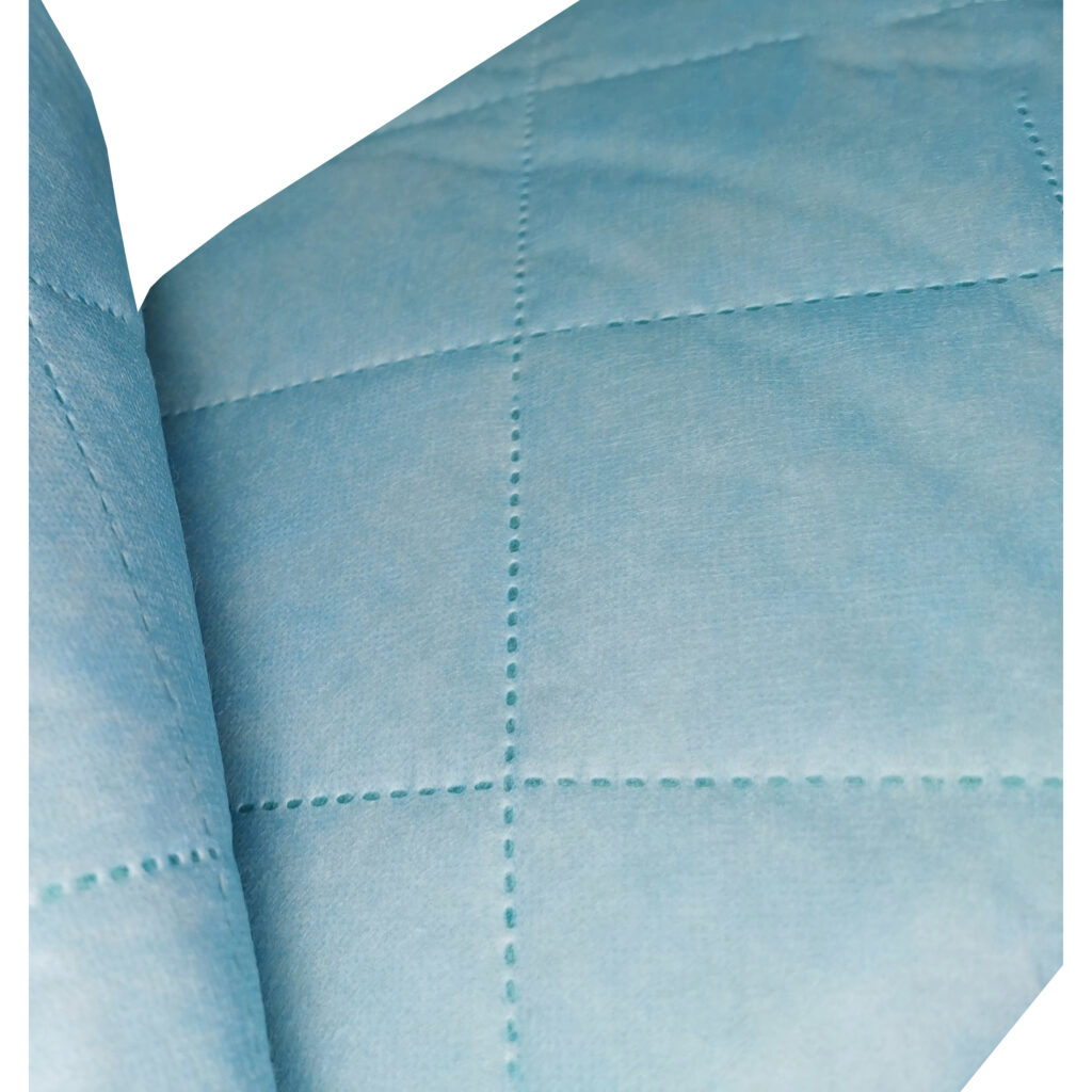Close-up of blue quilted fabric texture.