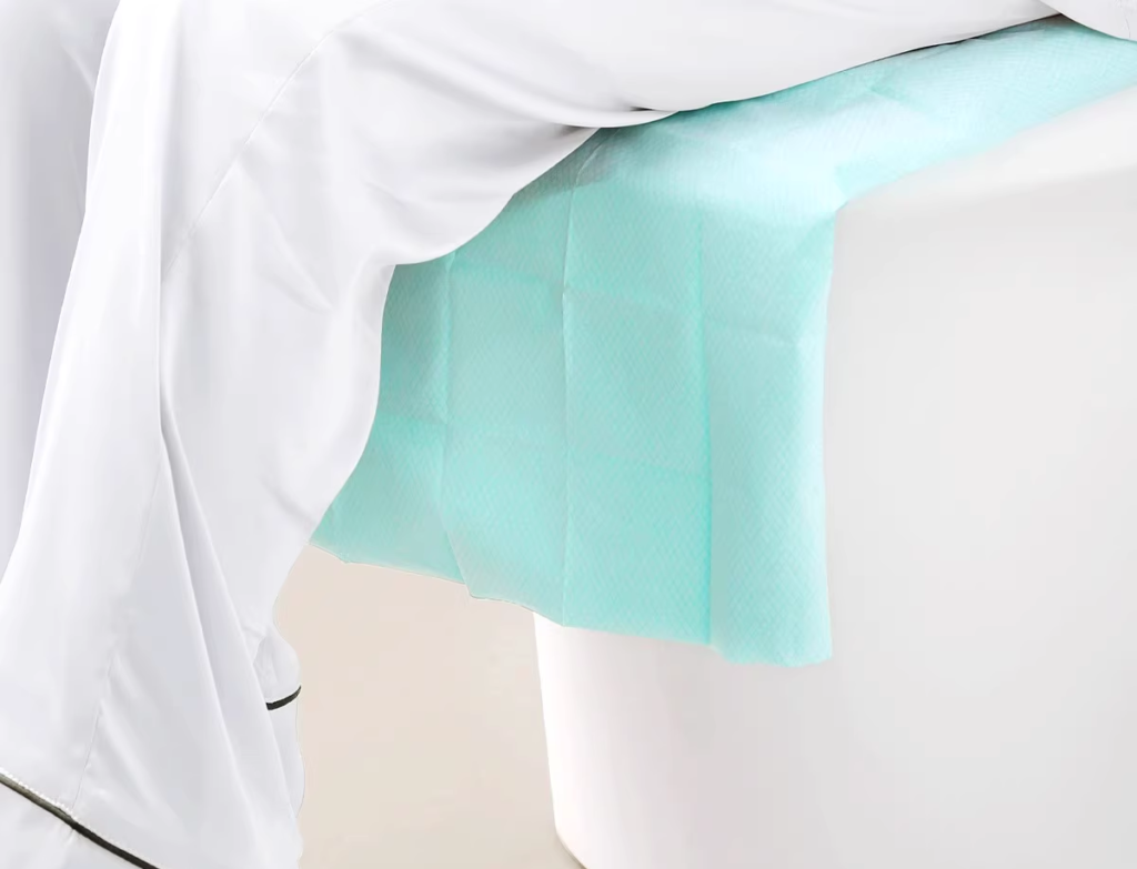 Patient's leg on medical examination table cover